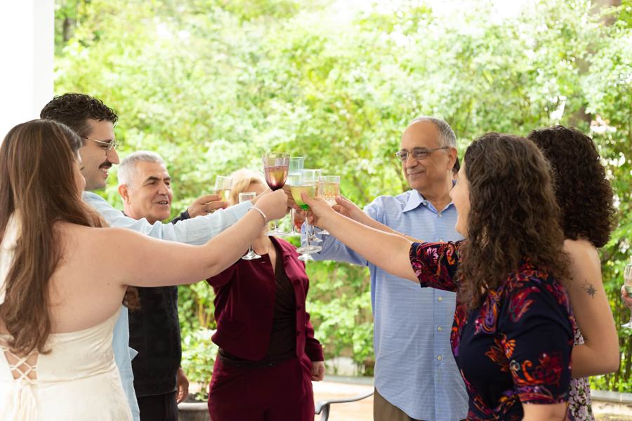 Family and friends raise a toast in a garden